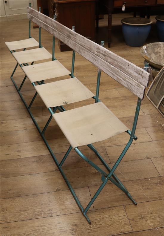 A pair of French folding canvas circus seats L.230cm